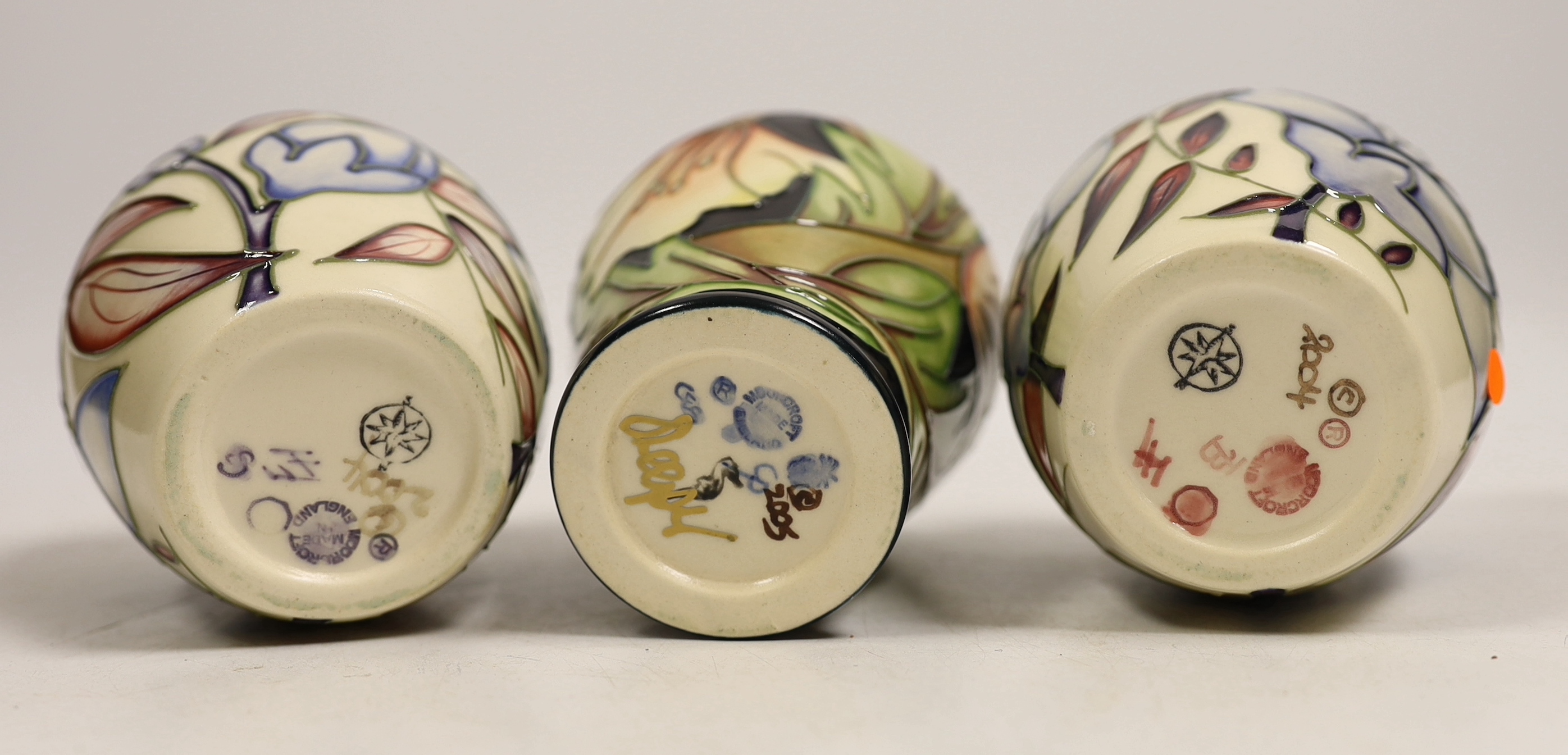 Seven small Moorcroft vases, various patterns. Tallest 10cm